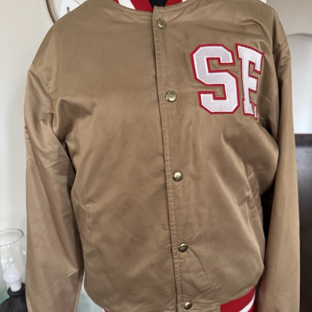 Men’s San Francisco 49ers Bomber Jacket with Red SF Logo/ Gold Blooded on back.